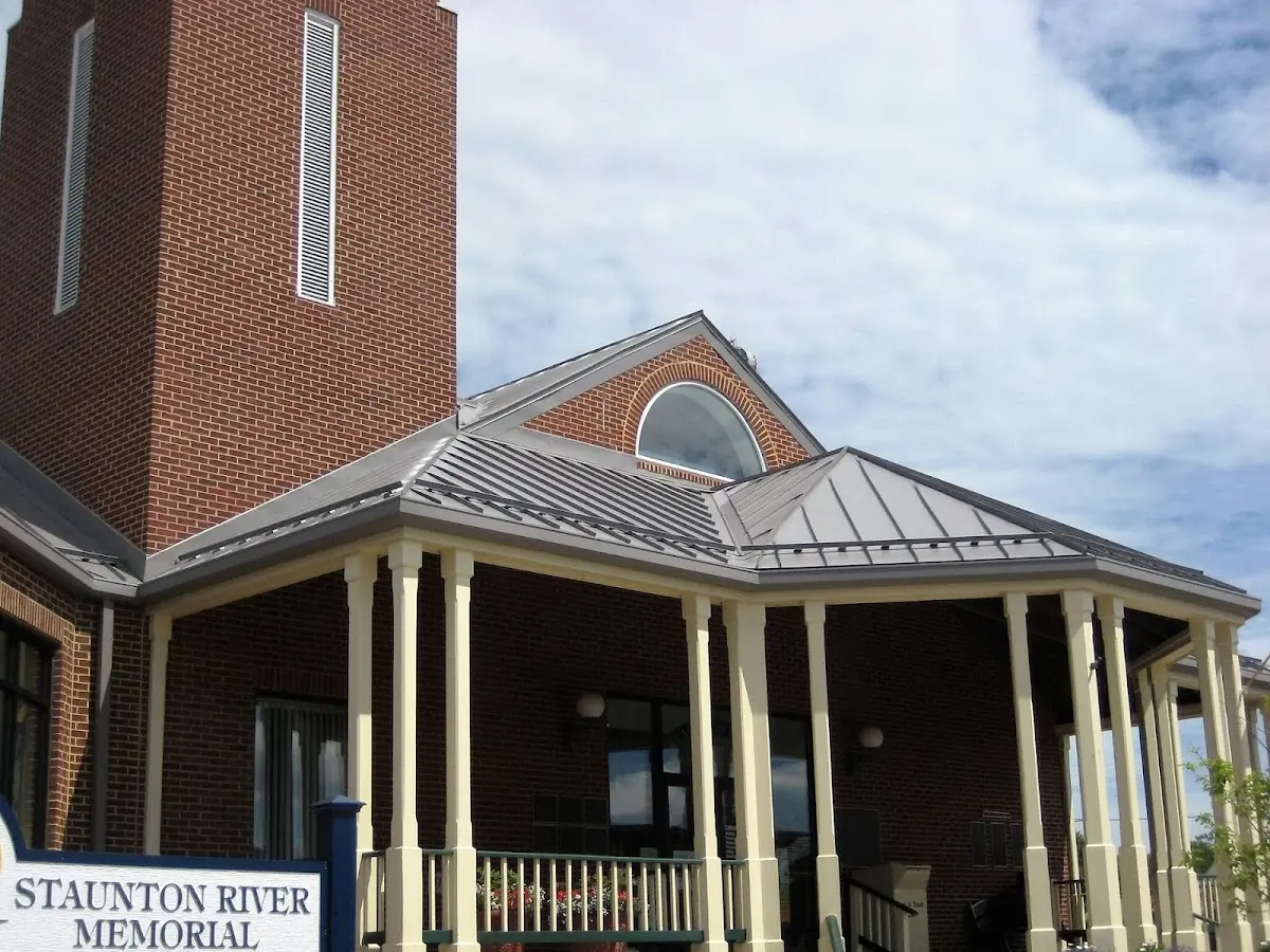 Skilled roofing craftsmen working on a residential roof in Silver Grove